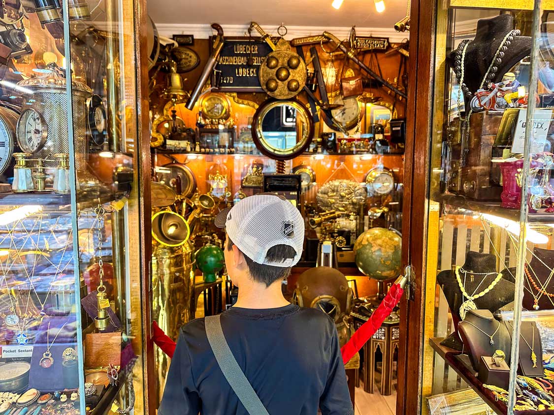 A boy gazes into an antique shop in the Grand Bazaar of Istanbul