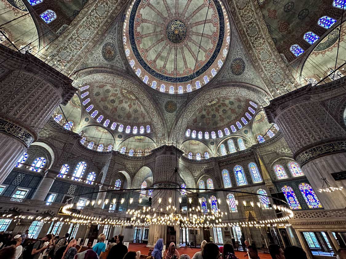 Intricately tiled domed ceiling of the Blue Mosque, one of the top things to do in Istanbul