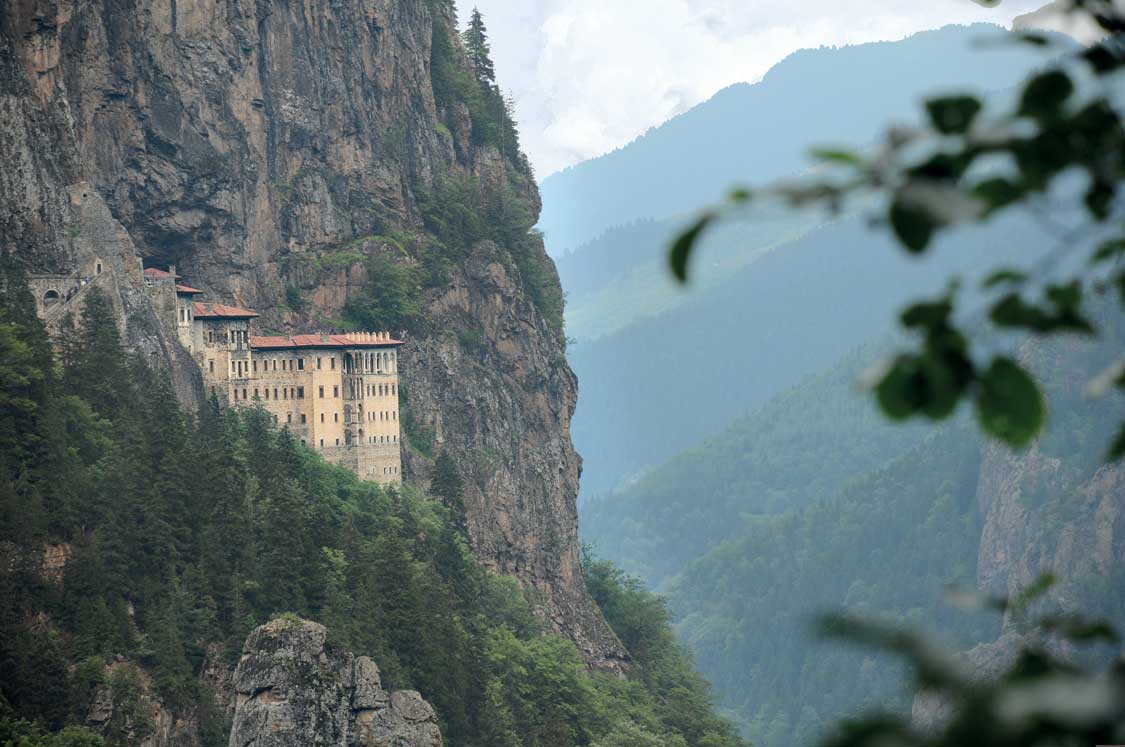 The beautiful cliffside Sumela Monastery backed by mountains