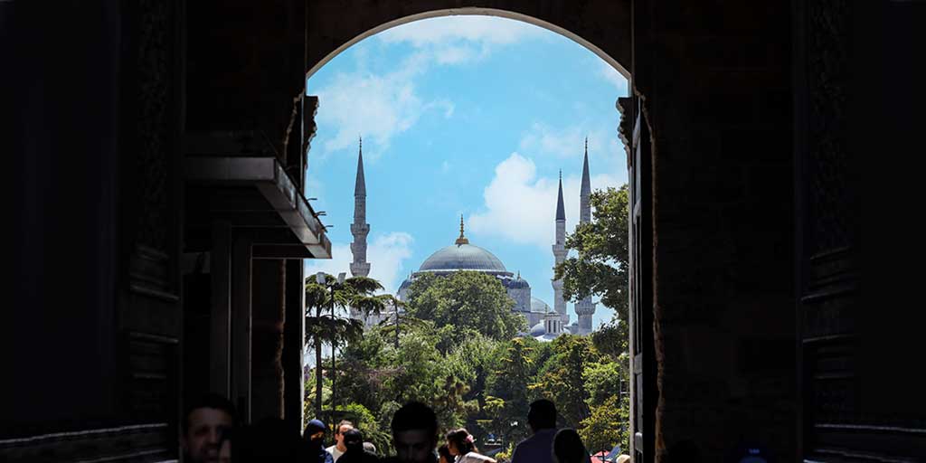 Blue Mosque seen through the doors of Topkapi Palace two of the best things to do in Istanbul