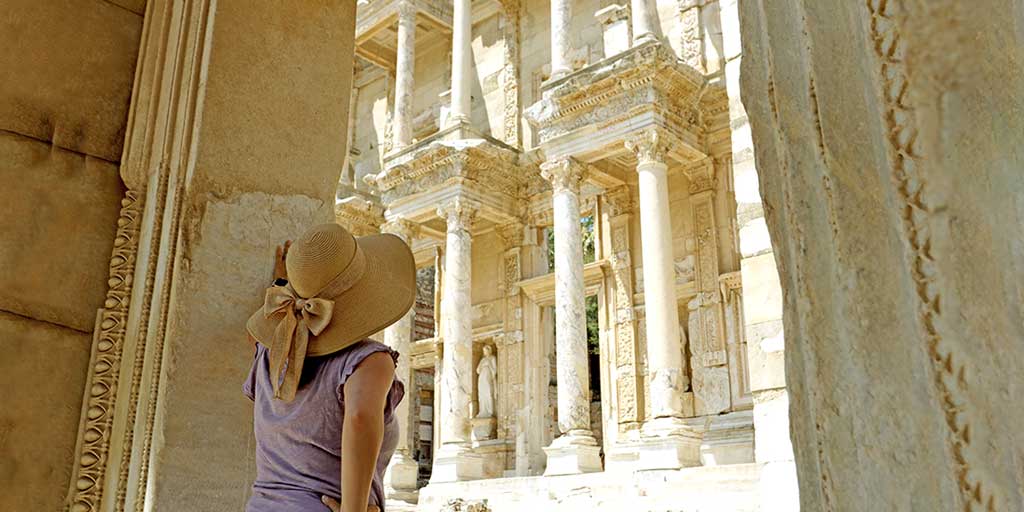 A woman looking at the Library of Celsus one of the best things to do in Selcuk, Turkiye