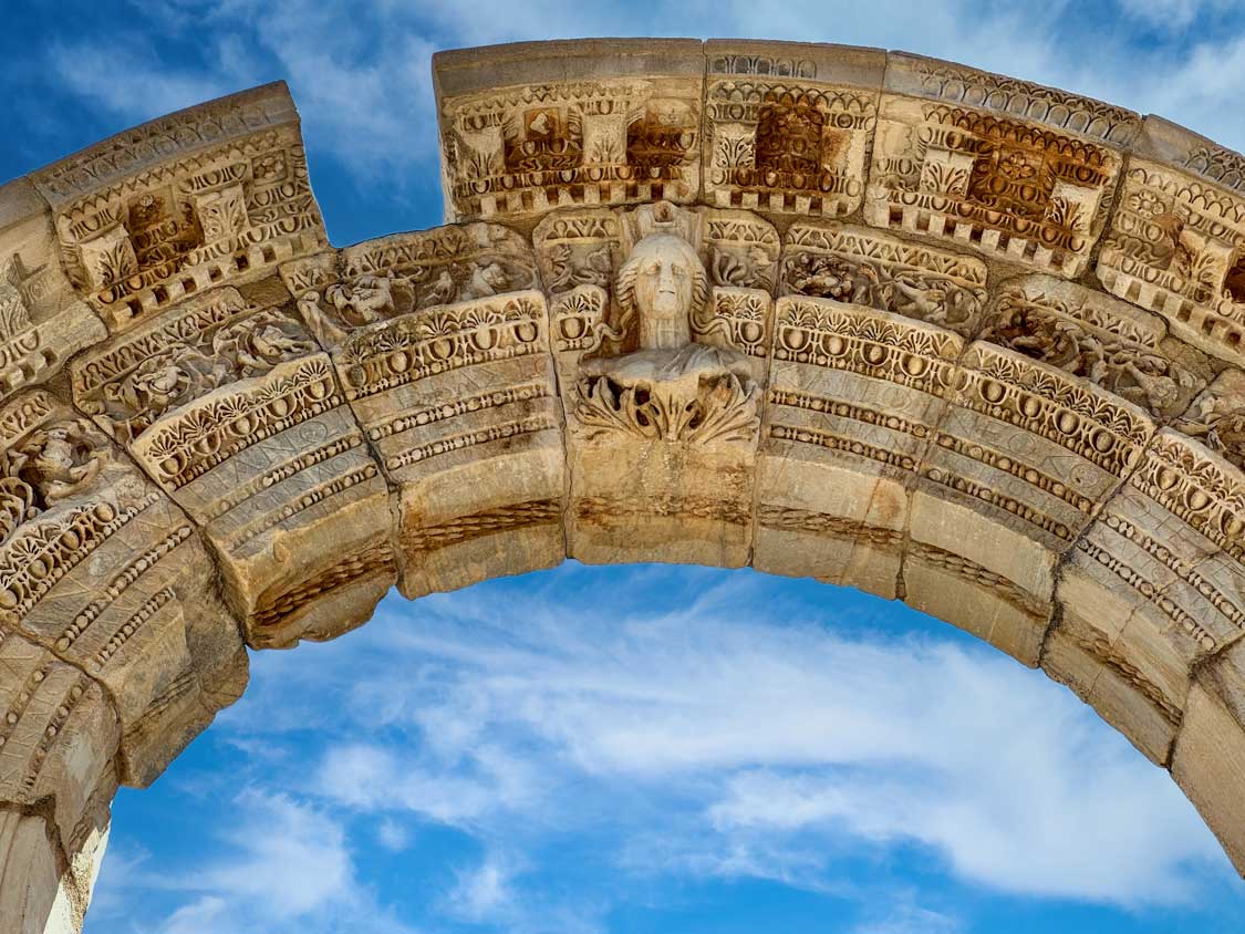The very detailed Hadrian's Arch against a blue sky