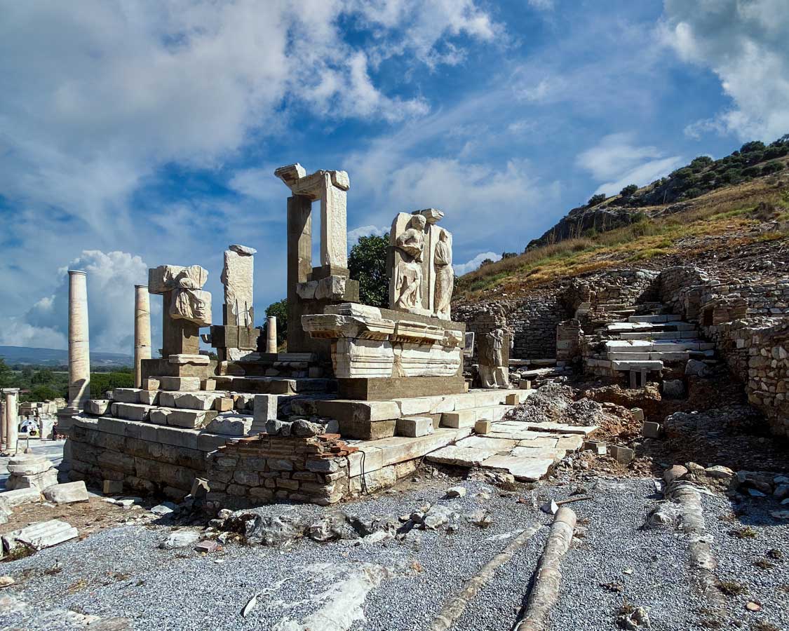 An Ephesus ruin known as Memmius Monument with colums topped with reliefs