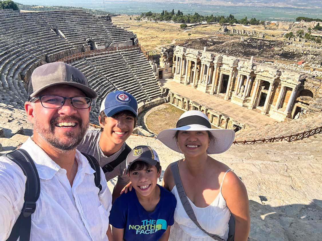 Wagar family smiling for a selfie at the amphitheater in Heirapolis, Turkiye