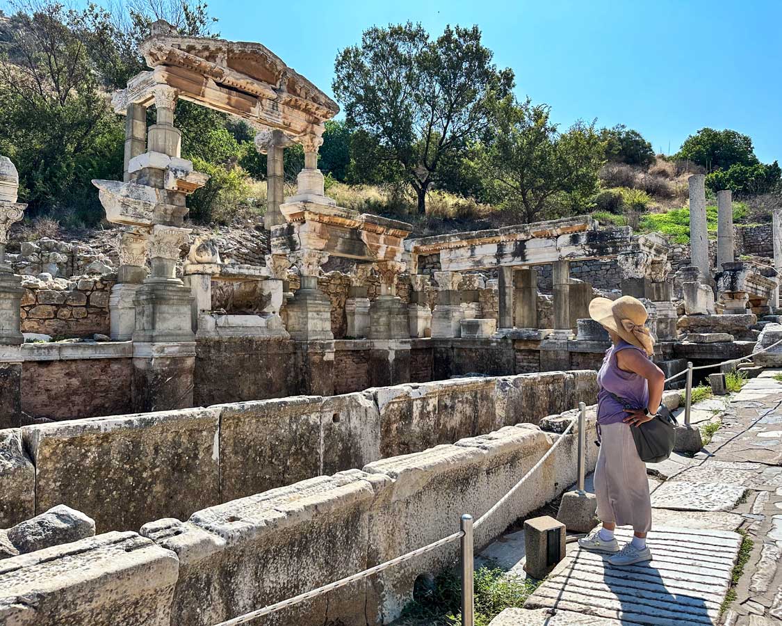 Woman looking at the ruins of Ephesus Turkiye