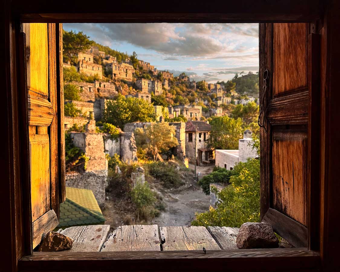 Kayakoy abandoned village seen through the window of one of the town's homes