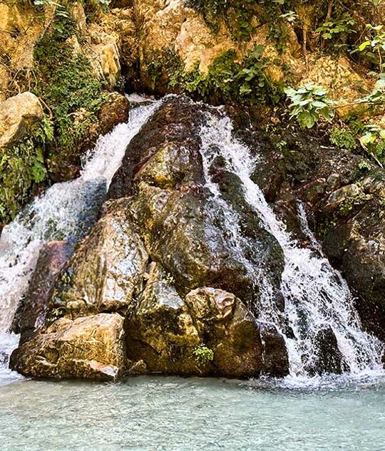 A waterfall comes out of a mountain at Saklikent Gorge in Saklikent National Park