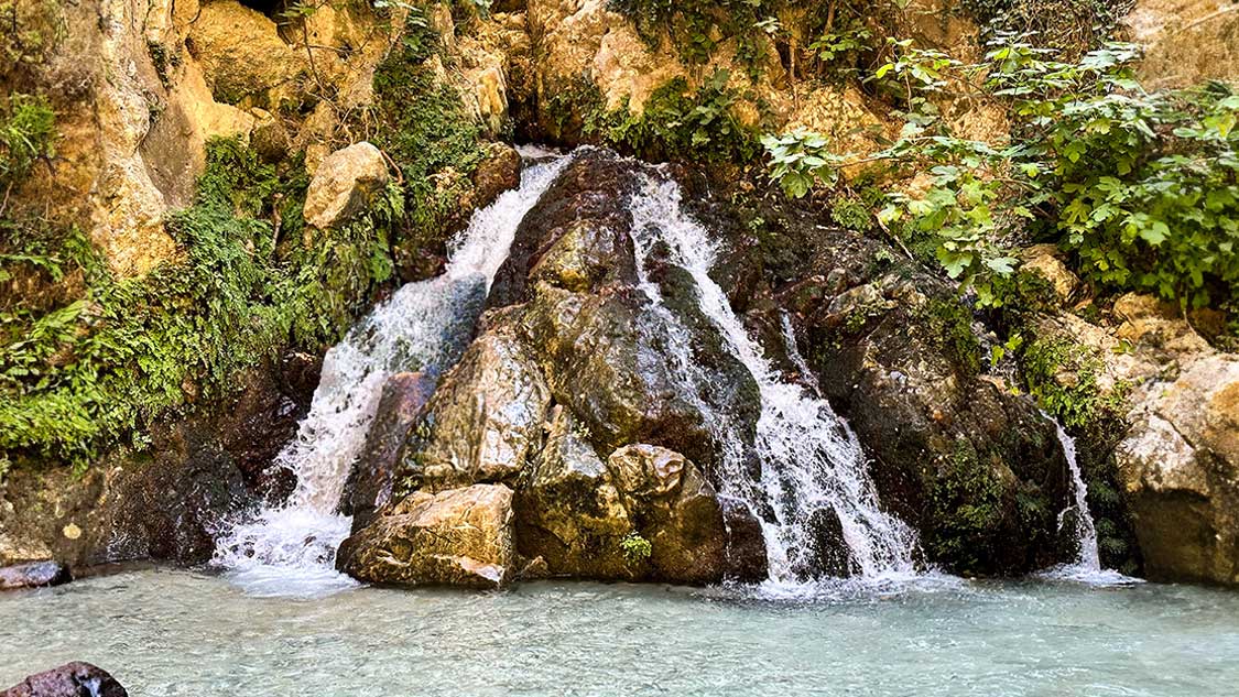 A waterfall comes out of a mountain at Saklikent Gorge in Saklikent National Park