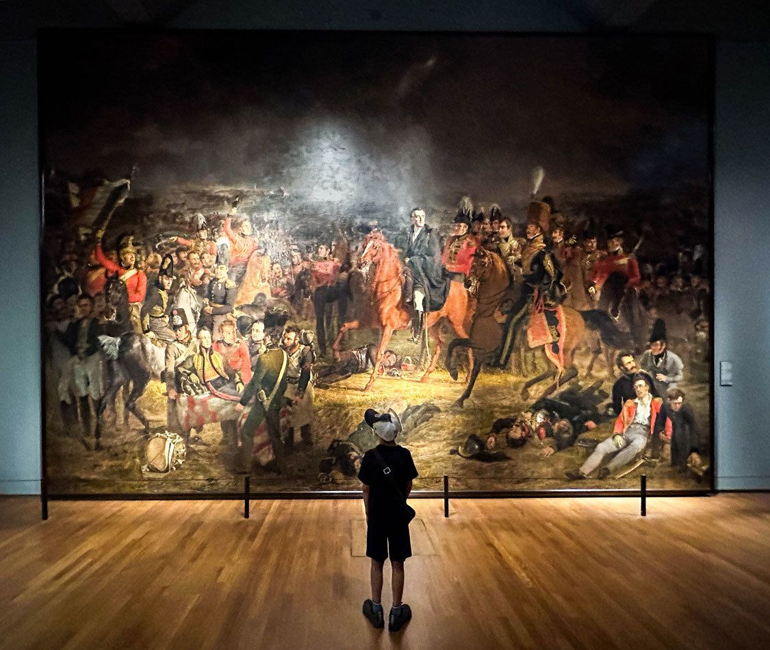 Dylan Wagar gazes at the Battle of Waterloo painting at the Rijksmuseum