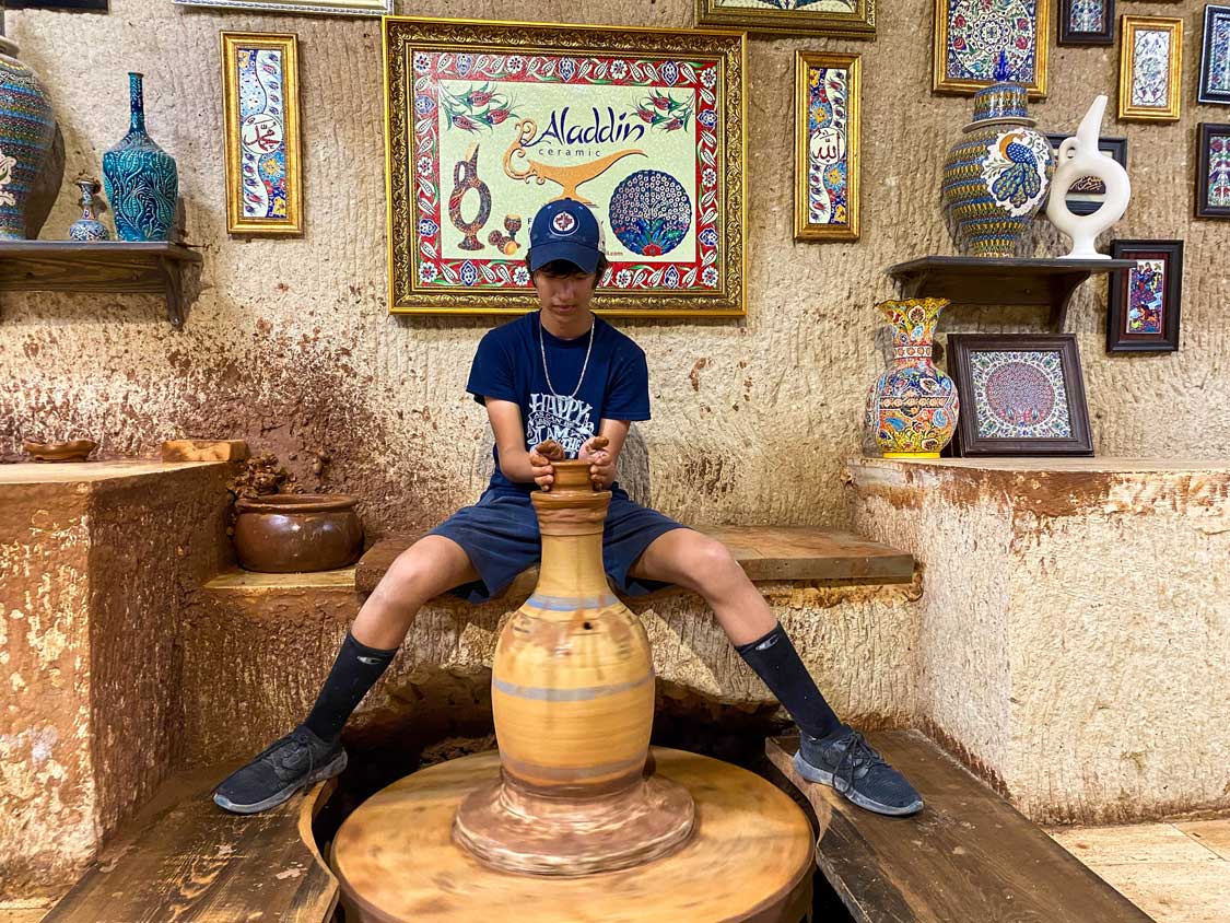A boy takes part in a pottery class in Urgup, Cappadocia