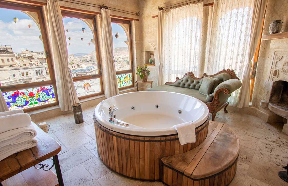 A hot tub overlooking the views of the Cappadocia valleys at Sultan Cave Suites Hotel