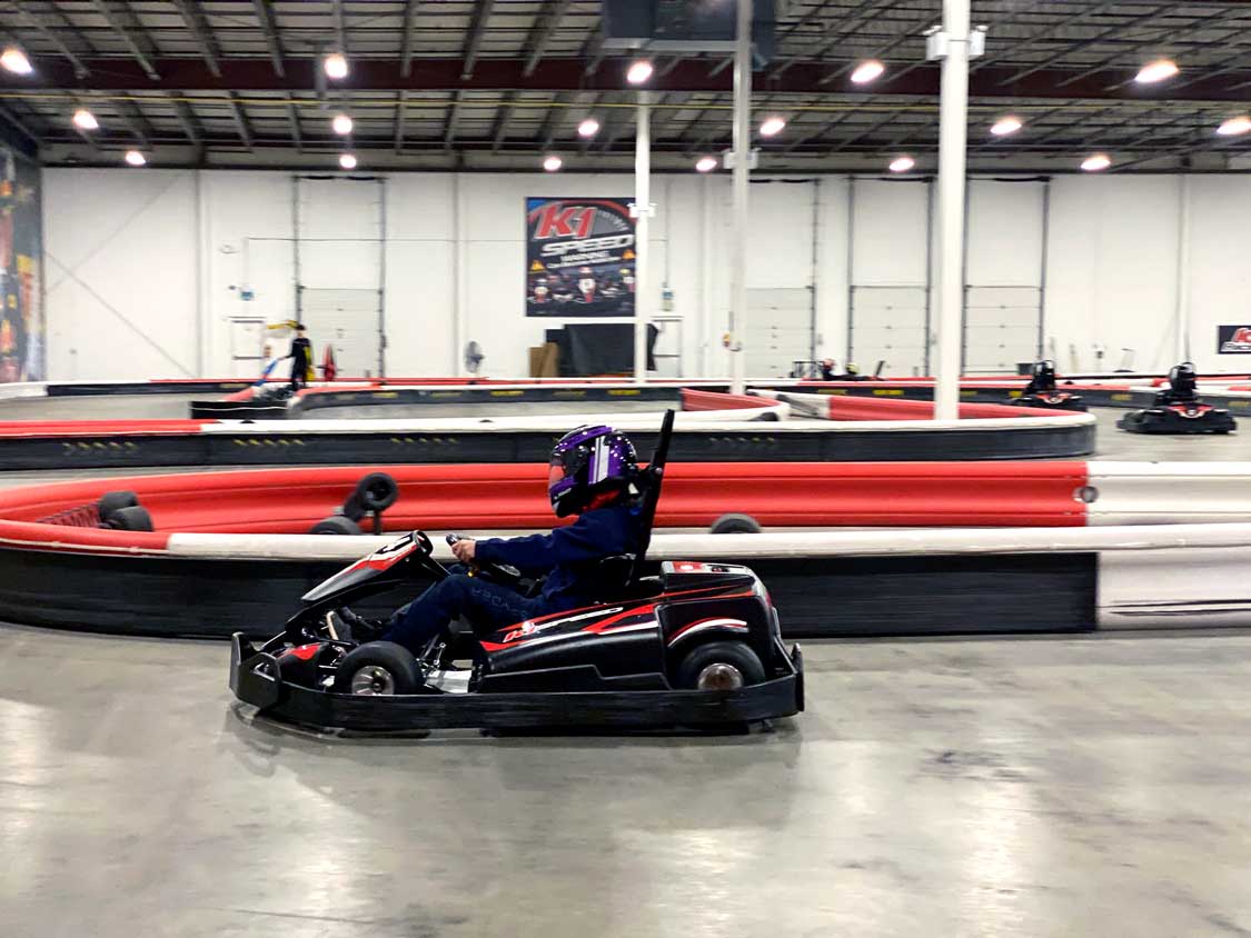 A boy racing a gokart at F1 Speed Mississauga