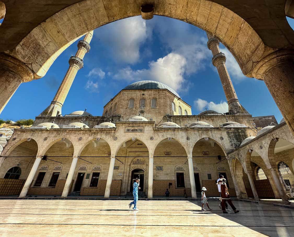 Grand Mosque in Sanliurfa, Turkiye seen through an arch