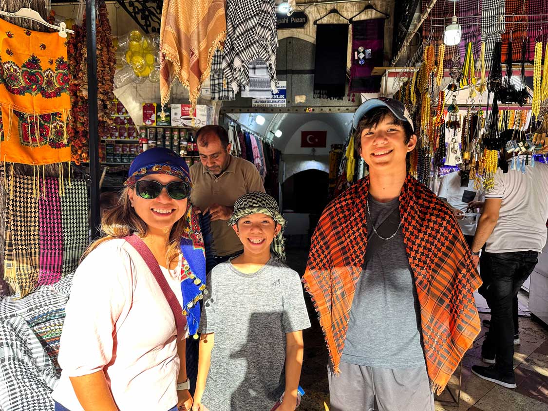 Wandering Wagars family shopping for scarves at the Sanliurfa Bazaar