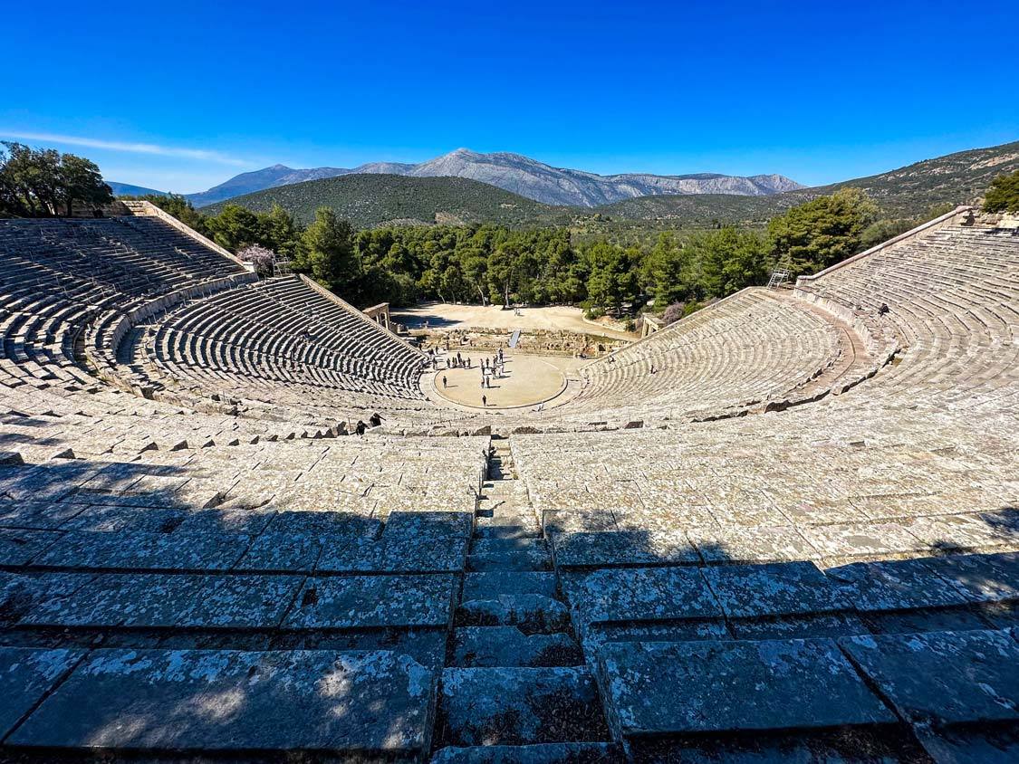 Two boys climb up to the top of the Epidaurius Theater