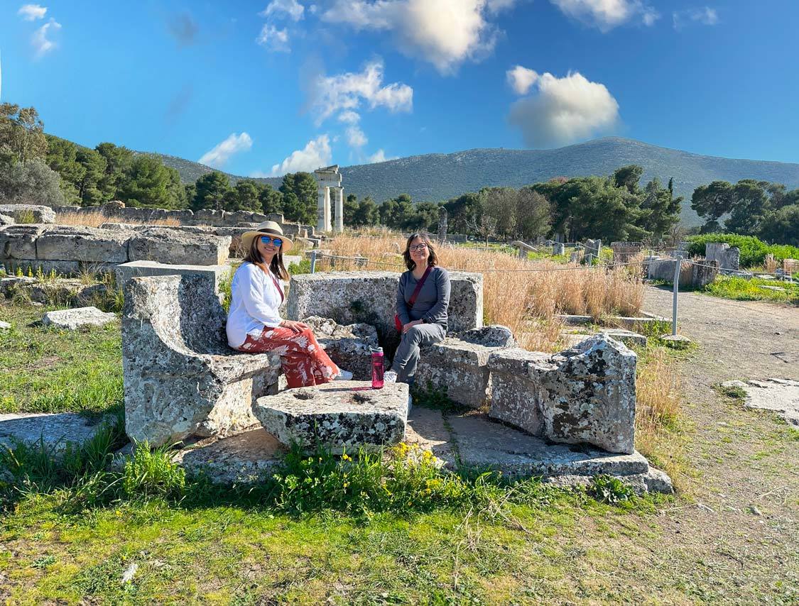 Christina Wagar and her mother sit on marble benches near the Altar of Asklepios in Epidaurus