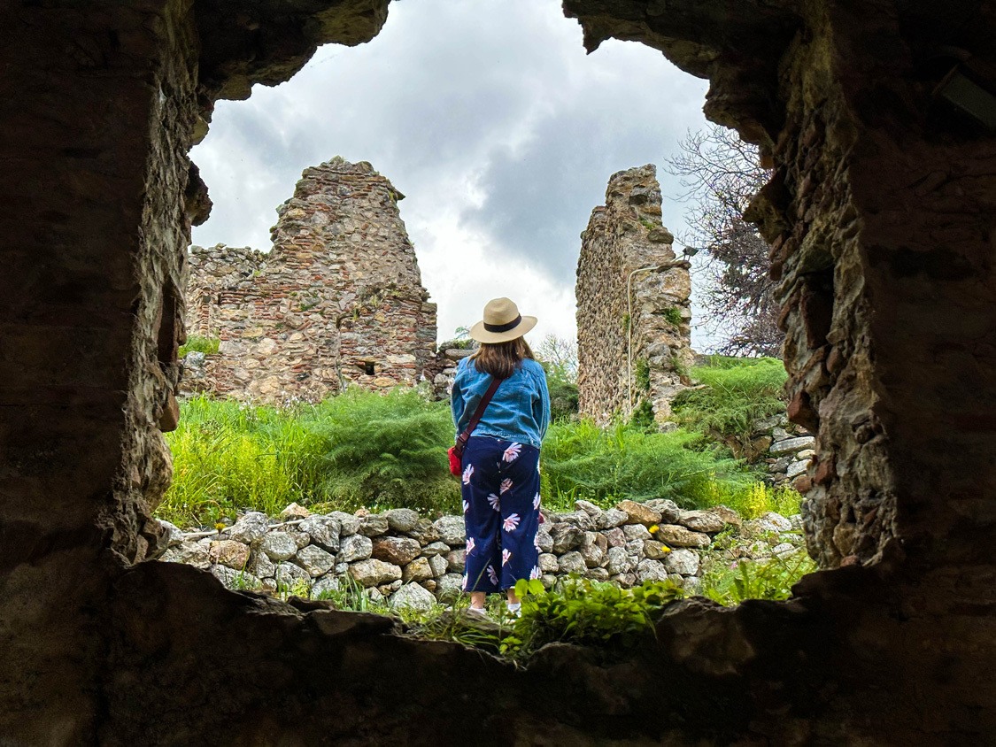 Christina looks up at the darkening skies of Mystras