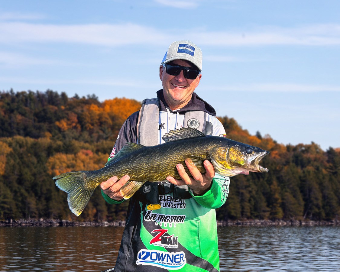 Profesional angler Frank Clark shows off a huge walleye that he caught in Lake Wanapatei.