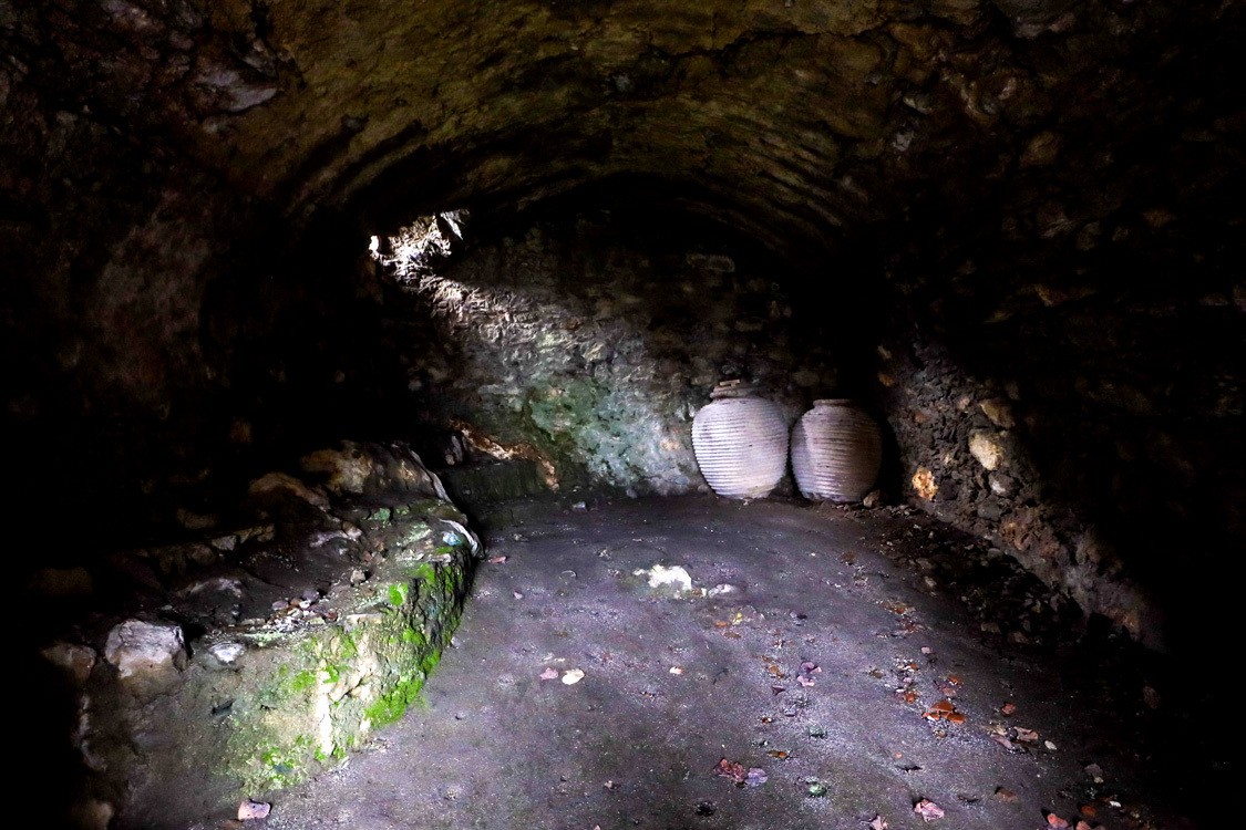 Wine barrels left behind in the crumbling ruins of a building in Mystras, Greece