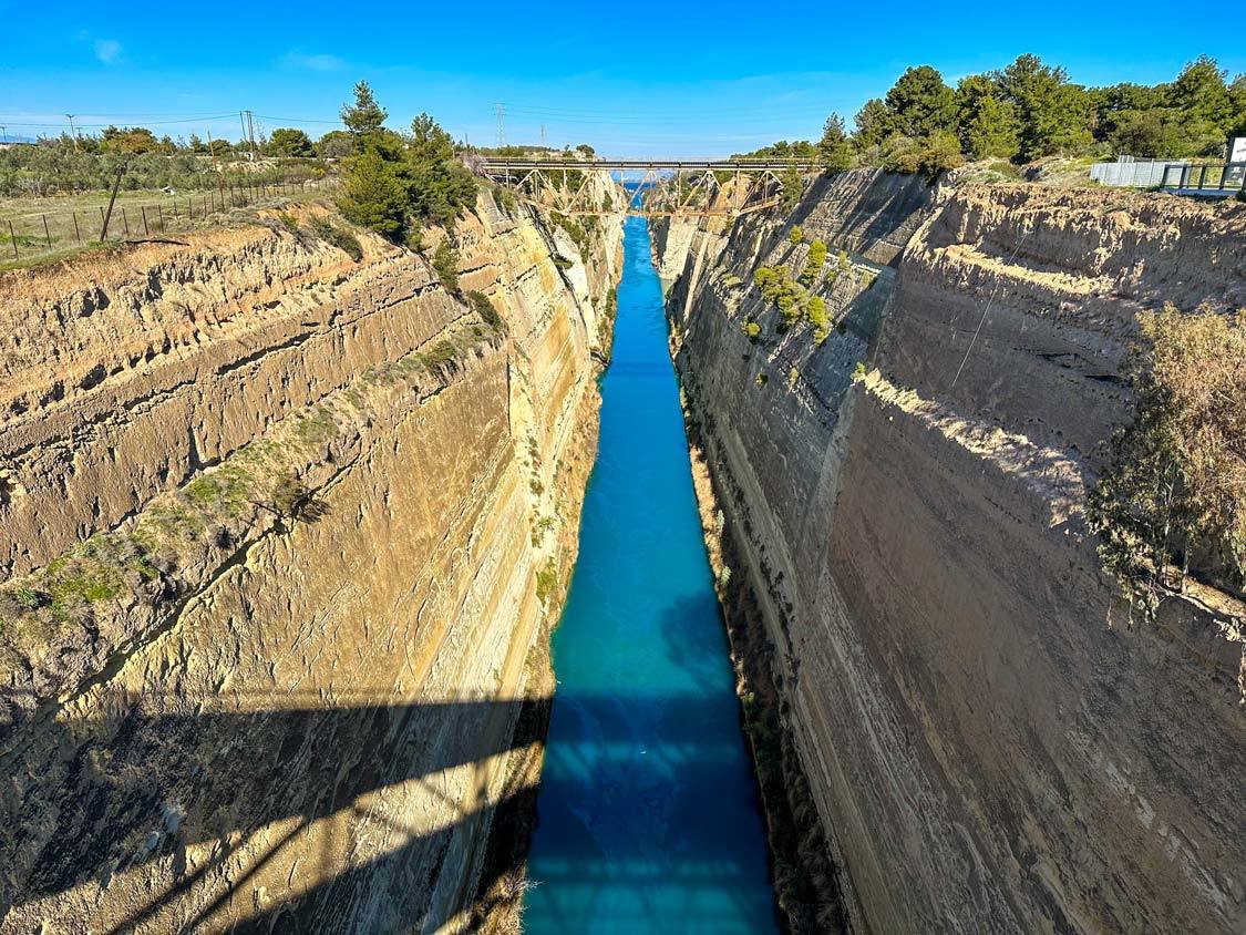 The Corinth Canal in Athens, a narrow band of water carved between two steep cliffs