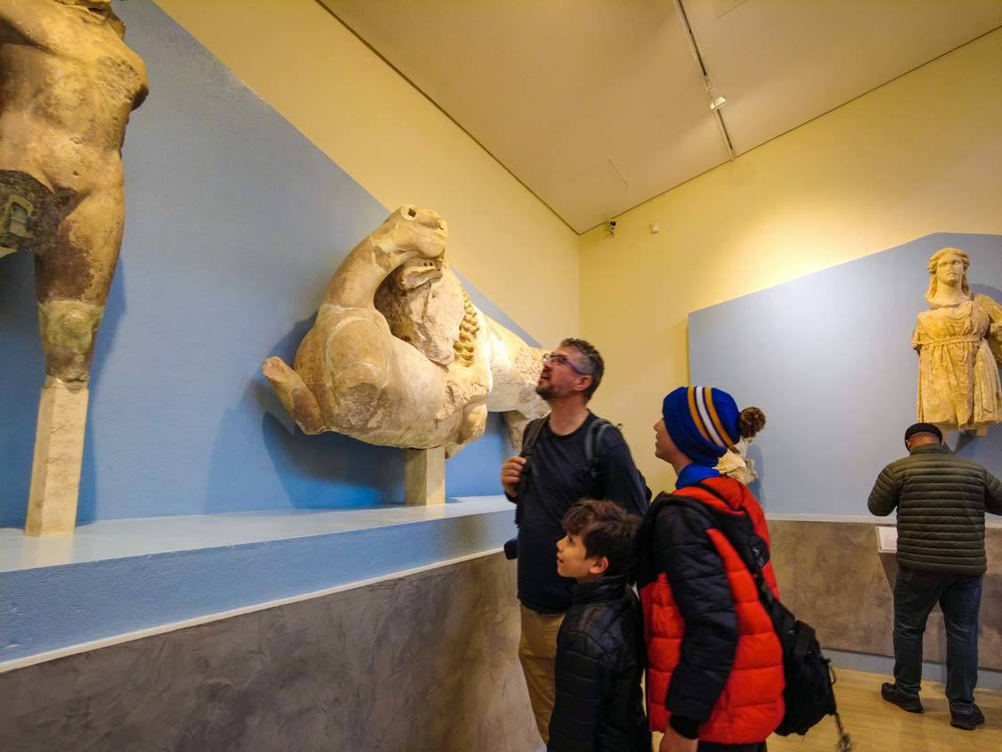 A father and his two boys check out displays at the Delphi Archeological Museum