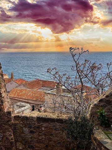 Sunset between historic buildings in Monemvasia, Greece