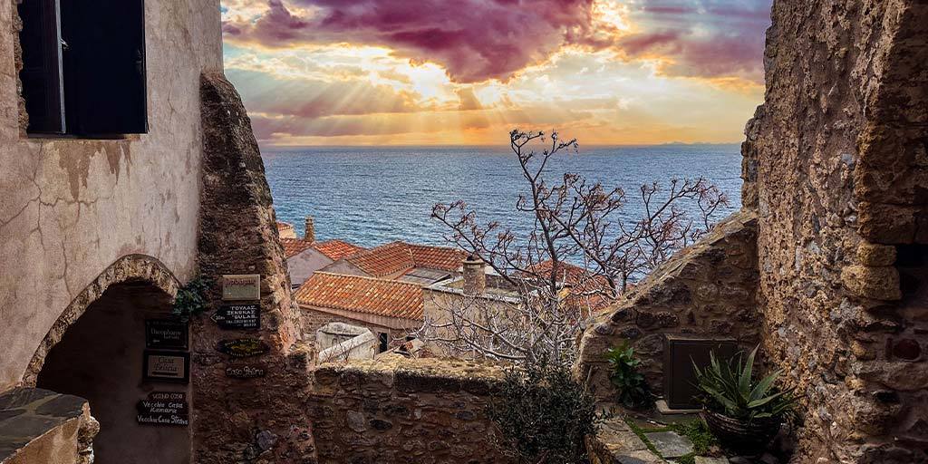 Sunset between historic buildings in Monemvasia, Greece