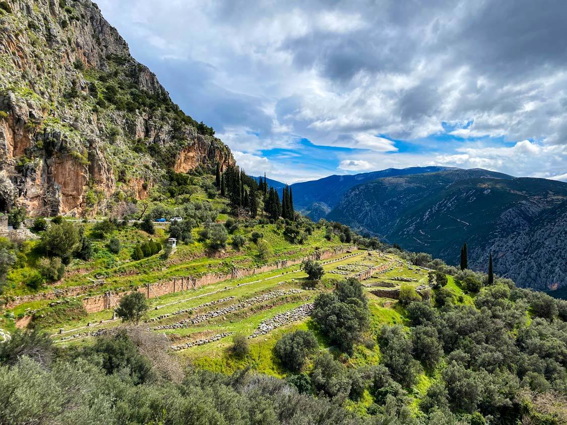 A collection of rocks and columns make up the ruins of the Gymnasium in Delphi, Greece