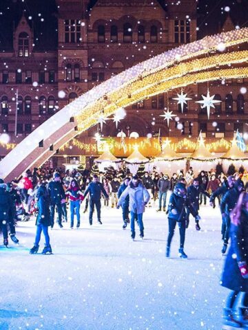 Skaters celebrating winter in Toronto at Nathan Phillips Square