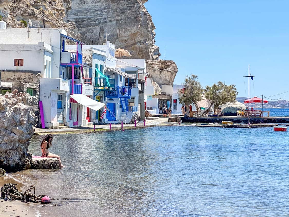 Swimmers bathe in the water off of Klima, Milos