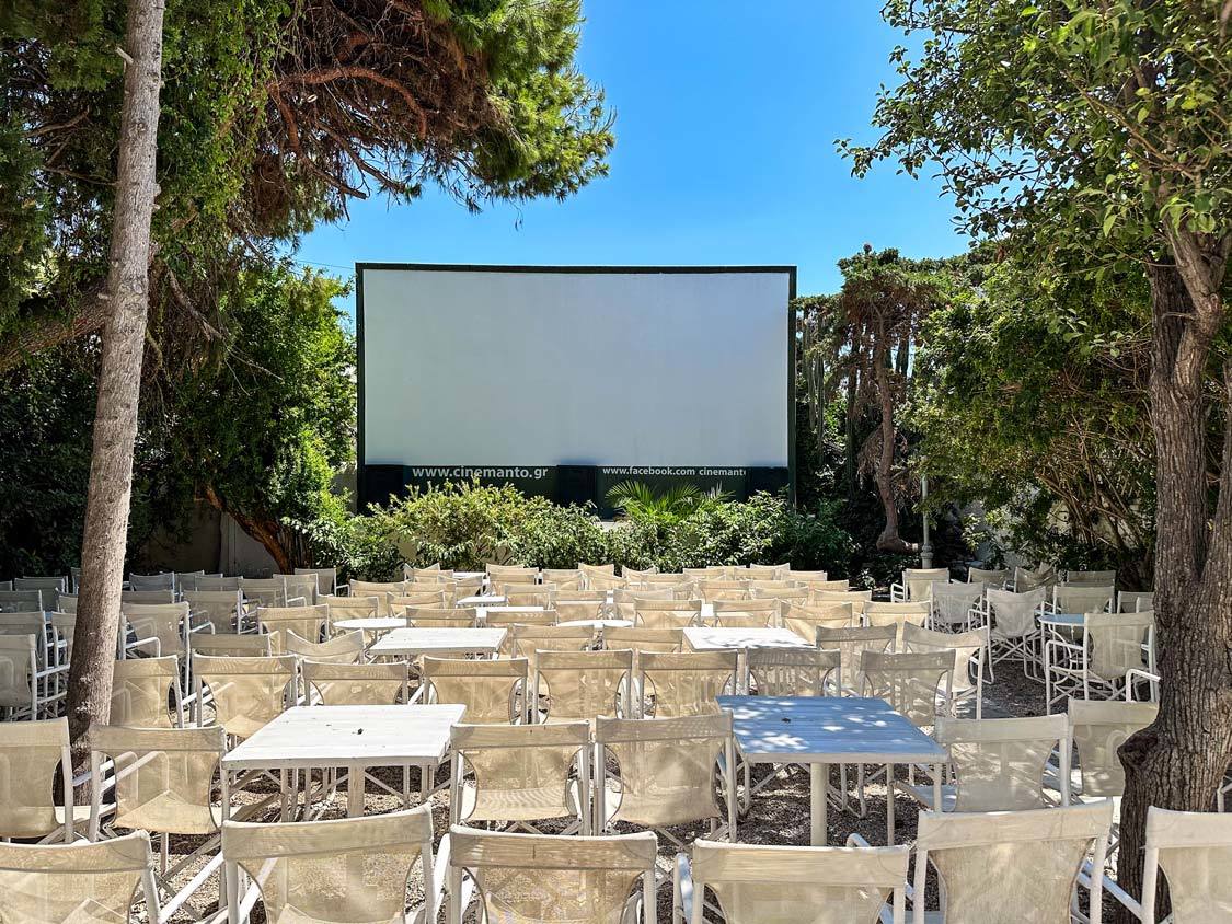 Tables and chairs lined up for an evening classic movie show at Cine Mantos on Mykonos, Greece