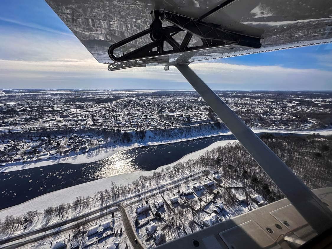 Looking out a float plane window over the Saint Mauricie River and Trois-Rivieres, Quebec