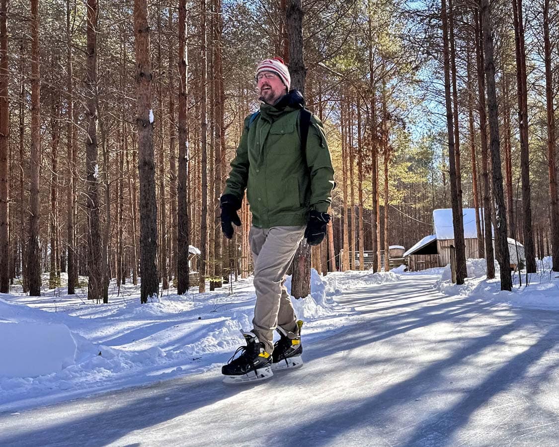 Man skating through forest trails at Domaine Enchanteur, Quebec