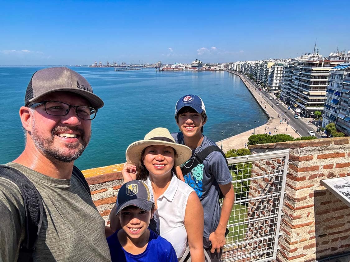 The Wandering Wagars family poses for a photo at the White Tower observation deck in Thessaloniki