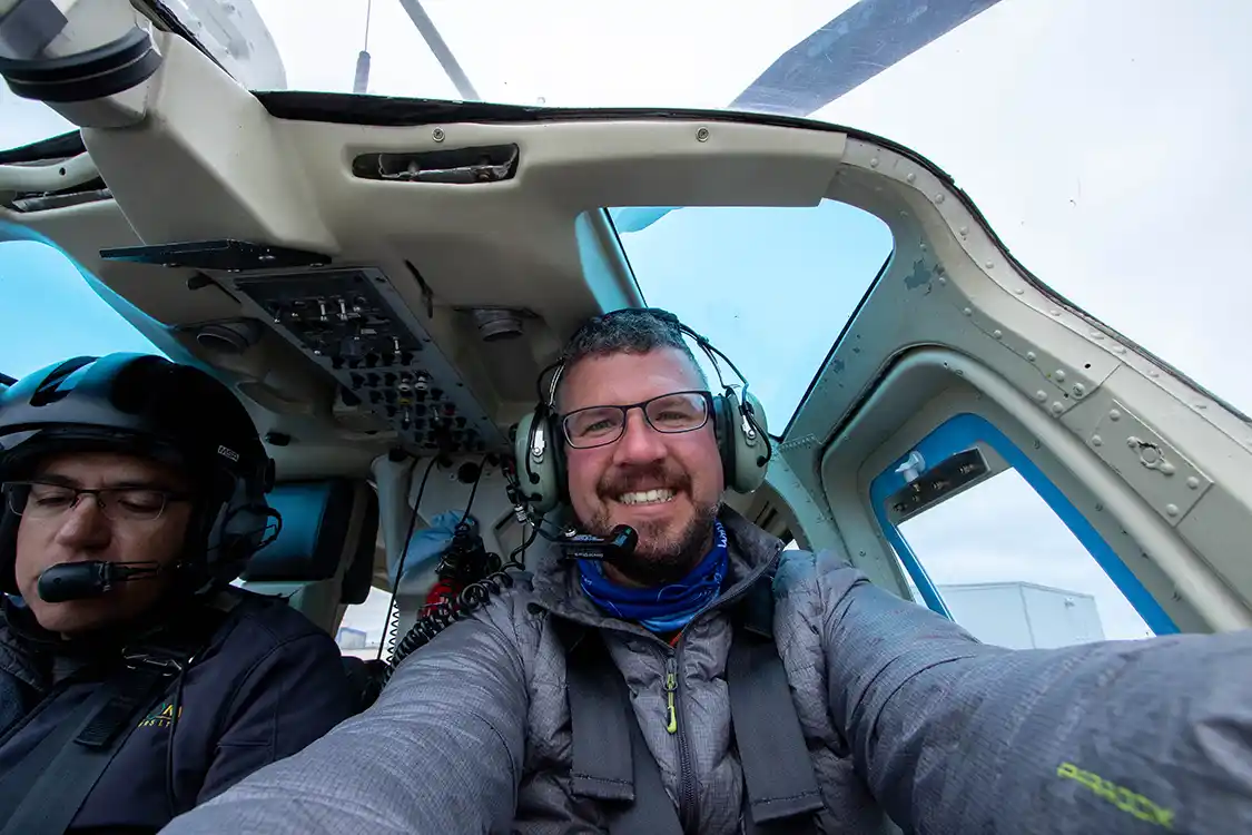 A man takes a selfie while on a flightseeing tour of Wapusk National Park