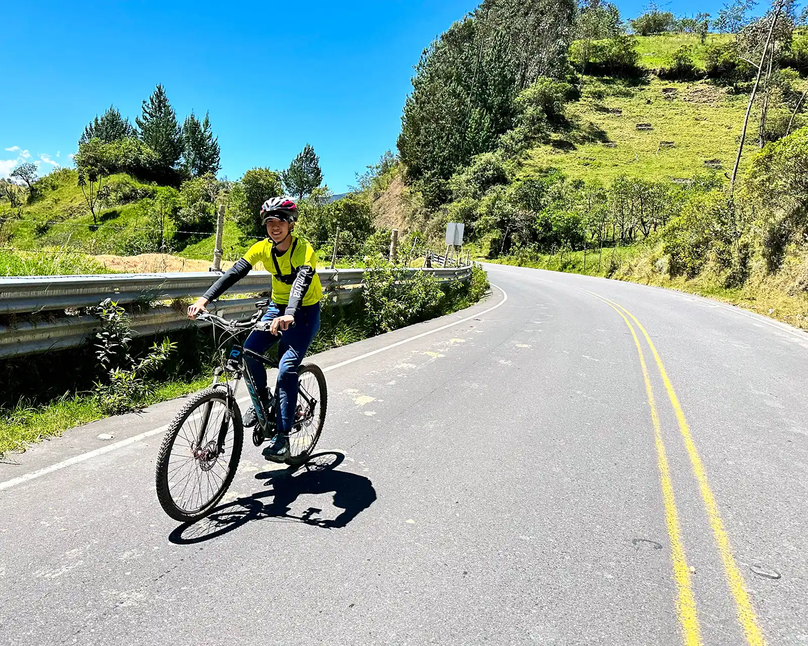 A boy mountain biking in Quilatoa