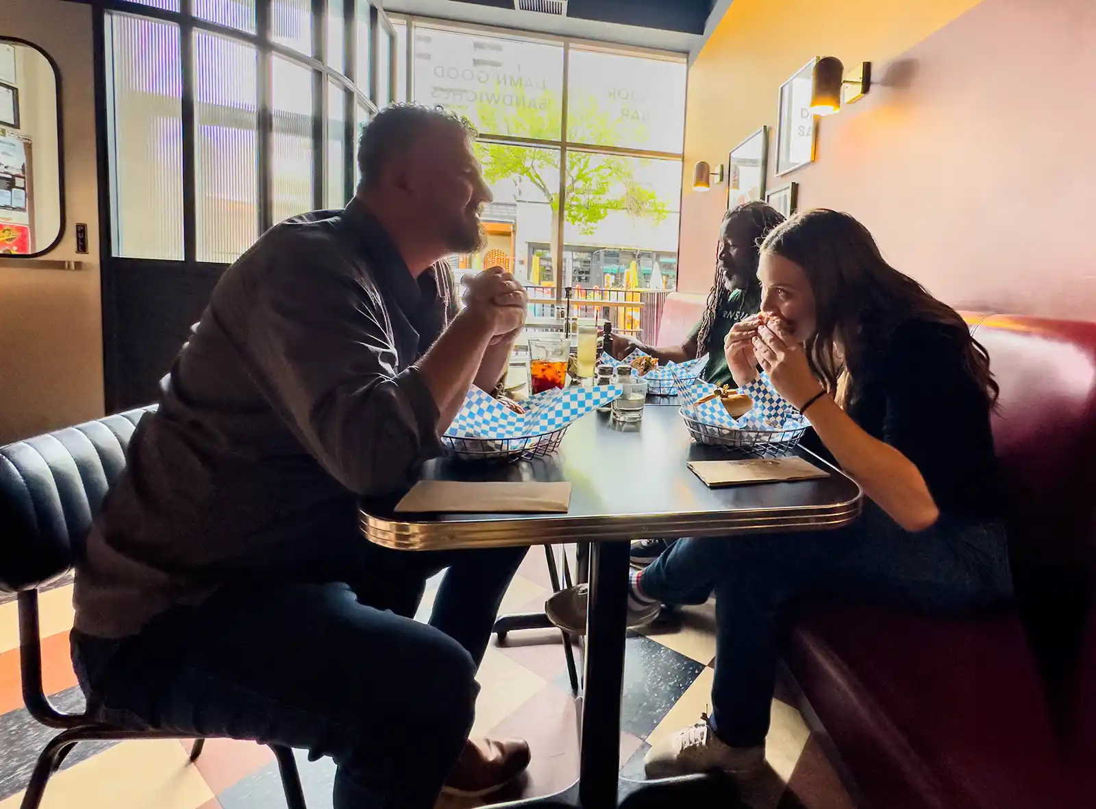 Three friends enjoy lunch at Alumni Sandwiches