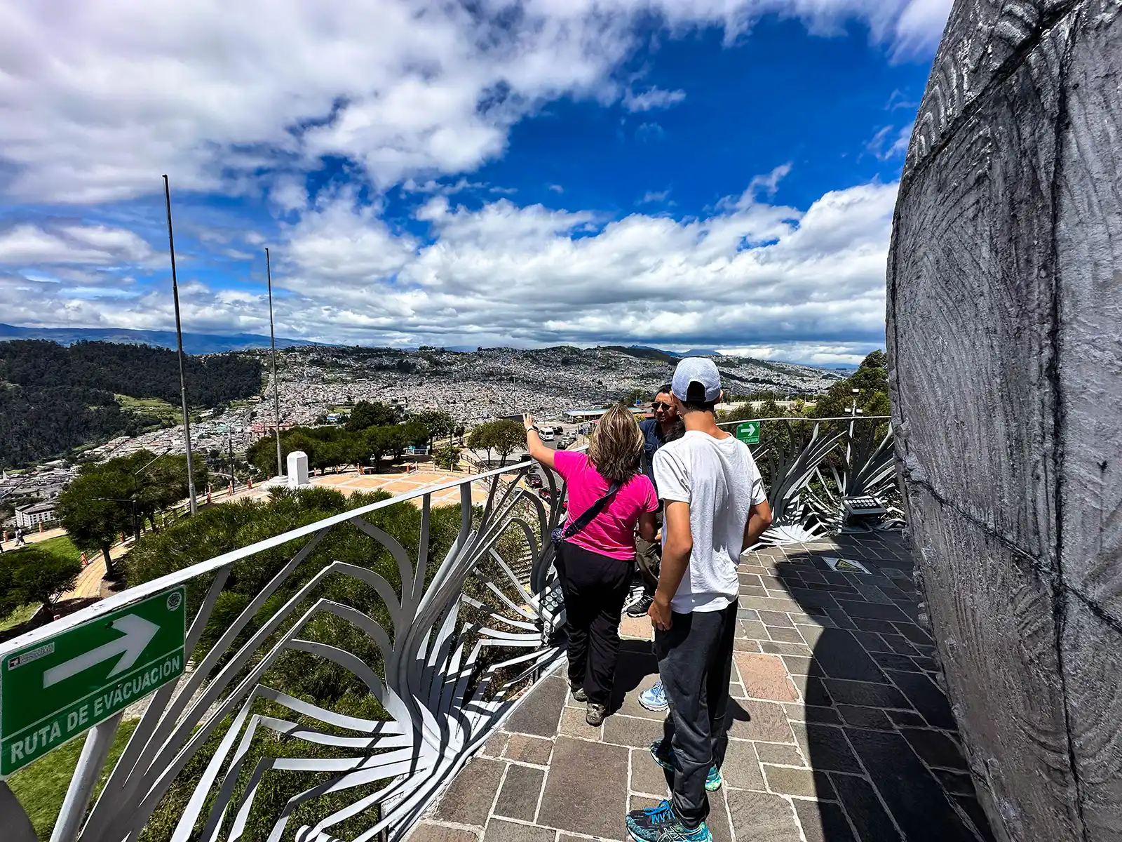 FAmily taking in the view of Quito from Virgin of the Panecillo