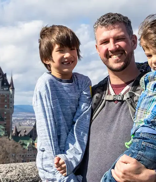 A father and his children preparing for adventure activities near Quebec City