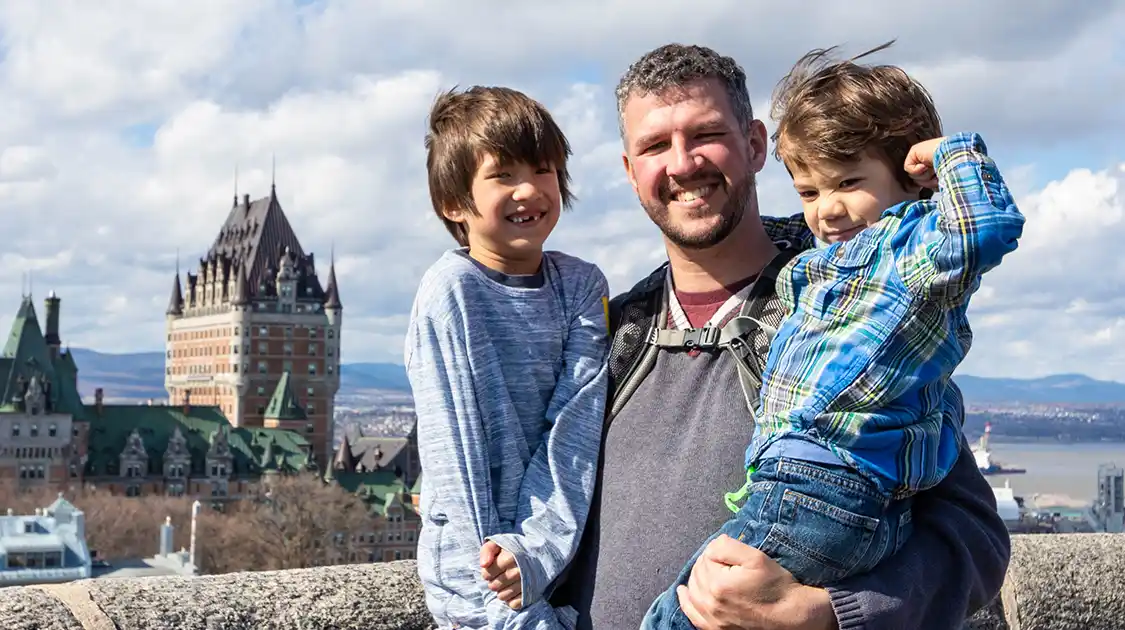 A father and his children preparing for adventure activities near Quebec City