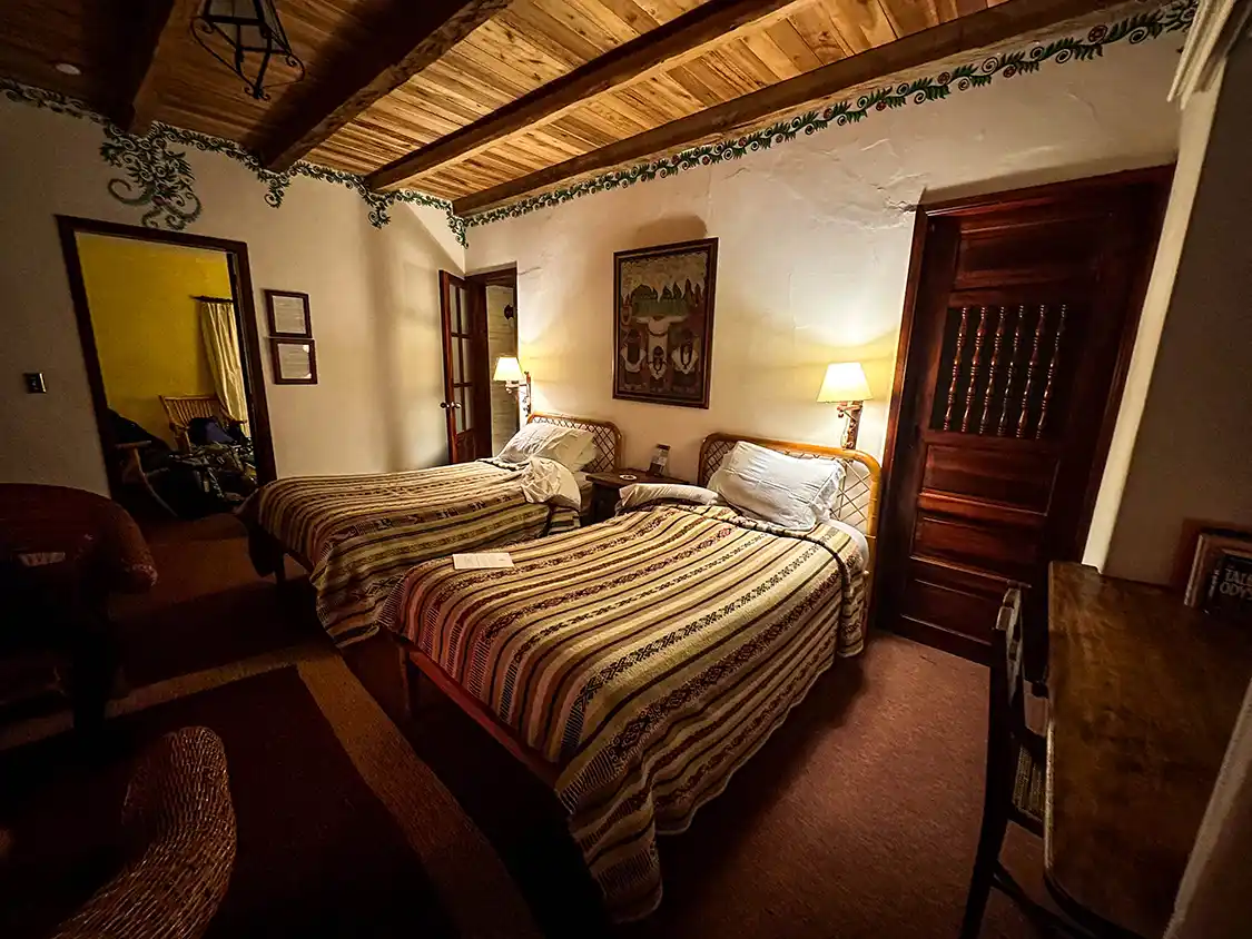 A cozy, historic hotel room at a former monaster in Otavalo, Ecuador