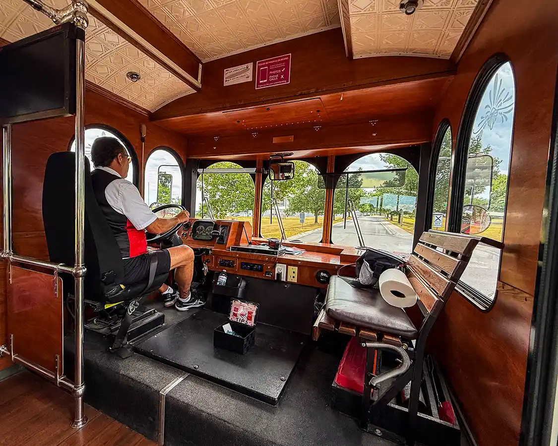 A trolley driver navigates the streets of Kingston, Ontario