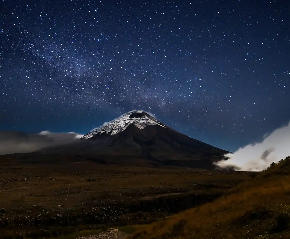  blanket of stars fills the sky above Cotopaxi Volcano in Ecuador