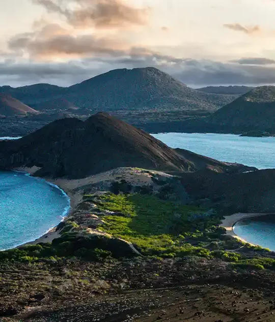 One of the Galapagos Islands splits the Pacific Ocean at sunset