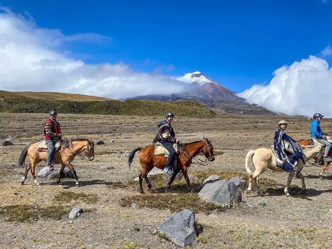 Kevin Wagar and his two sons, Cohen and Dylan riding horses in Cotopaxi National Park