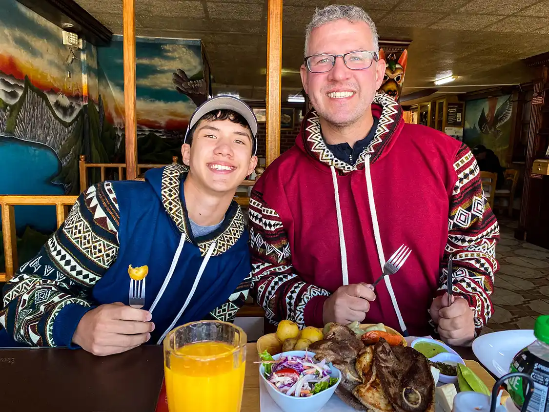 A fater and son enjoy a simple dinner at the Black Sheep Inn