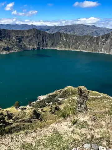 The beautiful Quilotoa Ecuador volcanic crater with turquoise water surrounded by steep cliffs