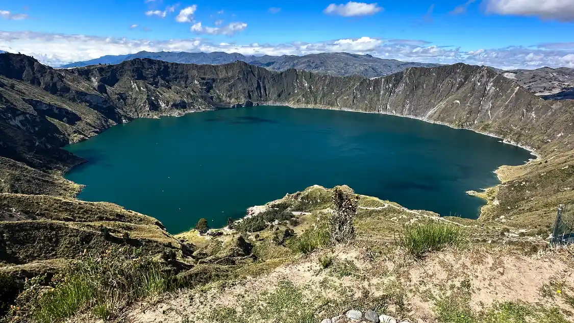 The beautiful Quilotoa Ecuador volcanic crater with turquoise water surrounded by steep cliffs