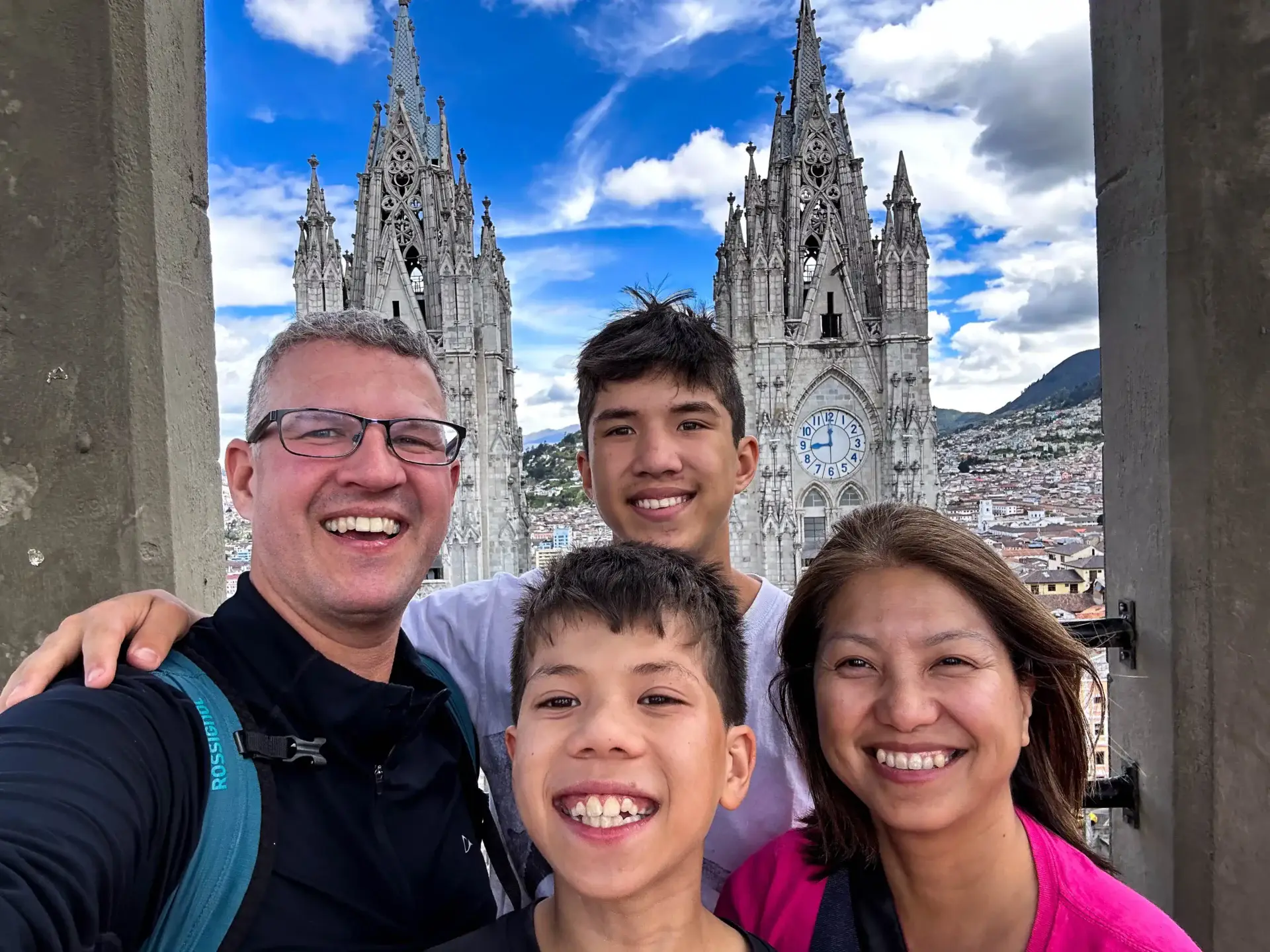 Family smiles for a photo at Basílica del Voto Nacional