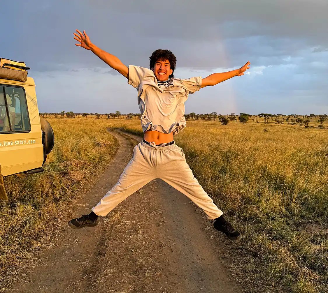 A teenager jumps for joy on the Northern Circuit Safari in Tanzania